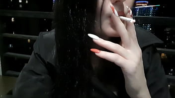Preview 4 of Xxxx Hd Videos Vip - Dominatrix Nika smokes sexy in the evening on her balcony and blows smoke in your face.
