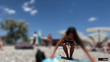Preview 1 of Son Kron - Tanned babe oils up on a public nude beach