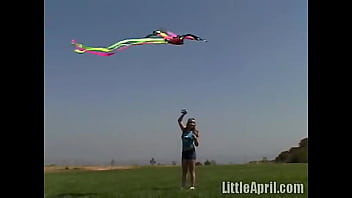 Preview 1 of Quock - Teen rubbing her clit outdoors and sucking a popscile - Little April