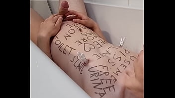 Preview 1 of Black White Catfight - Teenage slave with bodywriting peeing all-over himself