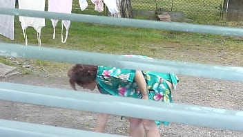 Preview 2 of Osang Scandal - MILF naked in public. Frinas husband watches through window as a pregnant neighbor without panties and a bra dries clothes in courtyard of house. Voyeur. Peeping. Public nudity. Outdoors POV