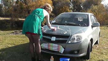 Preview 1 of Redhead Naomi Flame - Milf. Naked sexy outdoor. Outside in nature on river bank beautiful my without panties in stockings high heels washes car. Pretty in auto