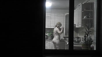 Preview 1 of Step Sister Xxx Cauth - Peeping. Voyeur. Neighbor pervert voyeur in evening on street looks out window as naked sexy neighbor in kitchen prepares dinner for her husband. Naked in public. Naked at home. Family.  Outdoor