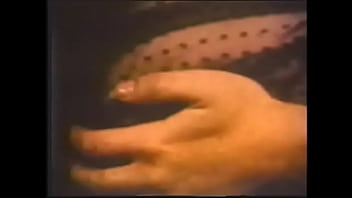 Preview 1 of Painful Woodman Casting - Horny brunette in black fishnet and stockings caresses her big melons and wet pussy while lying on the couch