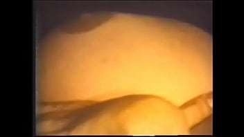 Preview 4 of Painful Woodman Casting - Horny brunette in black fishnet and stockings caresses her big melons and wet pussy while lying on the couch