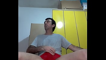 Preview 2 of Trany Crosdee - Fazendo strip tease tirando a blusa branca a cueca vermelha sexy Pau de leite Gostoso Safado Tesudo Pau Grande de 25 cm empinado  jorrando leite