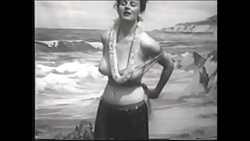 Preview 1 of Black Grandmabl - Playful lady with big melons takes off her Hawaiian outfit and shows her round ass on the beach