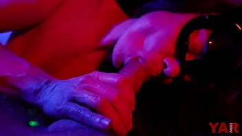 Preview 4 of Ghetto Chabee Creamy Lesbian - A masked woman sucks a big cock with an ending in her mouth a gentle blowjob in neon light to the music