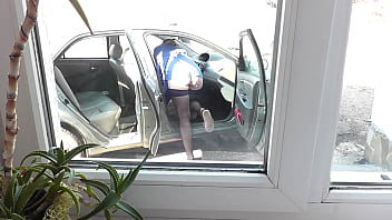 Preview 1 of Serina Maria - Naked in public. Sexy Milf Frina in yard cleans car interior in stockings without panties. Neighbor voyeur looks out window