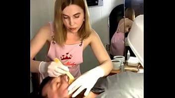 Preview 2 of Doll Cax - Classy blonde waxes a man&#039_s face,  her gorgeous breasts popping out