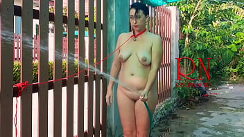 Preview 2 of Megan Rain Twococks - Slave Humiliation Slave woman and Master. Shower at the yard.