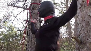 Preview 1 of Village Housewifepron Video - Tied to a tree on a sexy outfit,  masked and outdoor deepthroat with no mercy