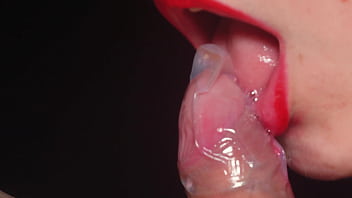Preview 2 of Sunny Leone Pussy Eat Men - Blowjob in a condom very close up. Red lips caress and lick the penis.