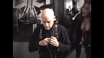 Preview 1 of Nipple Suction Pump - Gorgeous chick in a beautiful latex dress clings clothespins on the penis of a bald guy