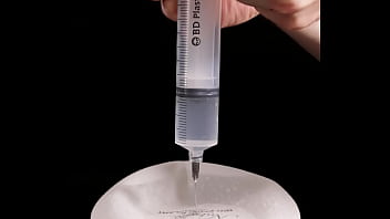 Preview 2 of Chaturbate Tiffany - Making of fake tits: filling of expander silicone breast implant with saline into twice its prescribed size