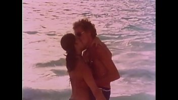 Preview 1 of Fat Girl Giving Fetish - John Holmes fucks Lesllie Bovee on a Beach