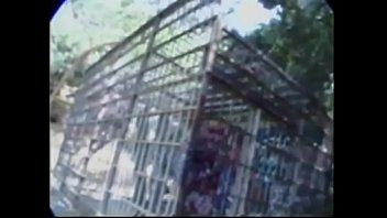 Preview 1 of Son Saw Sexy Mother - Muscled hunter in camouflage ass fucks slim gay prisoner in a cage in the forest