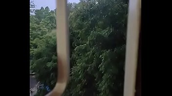 Preview 1 of Xxxx Nice - Husband fucking wife in doggy style by enjoying the rain from window