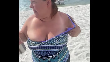 Preview 2 of Shemale In Chastity Cage - Slutty Bbw duca wife flashes her big tits on a public beach