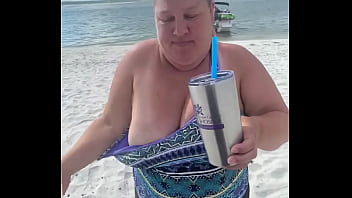 Preview 1 of Shemale In Chastity Cage - Slutty Bbw duca wife flashes her big tits on a public beach