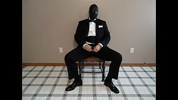 Preview 1 of Jabardasti Desi In - Seated in a tuxedo wearing a rubber cock and ball sheath and playing with my cock until I cum.