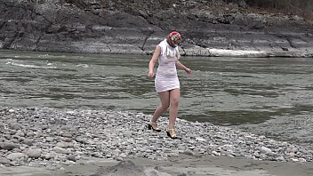 Preview 4 of 2020 New Year Xxx - Juicy ass and slender legs under a short narrow dress outdoors in a public place. Russian beauty exposes her intimate places while walking along the riverbank.