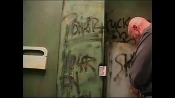 Preview 1 of Xxxwww 3gb - Horny blonde gives a blowjob to a guy from a neighboring toilet cubicle through a hole in the wall
