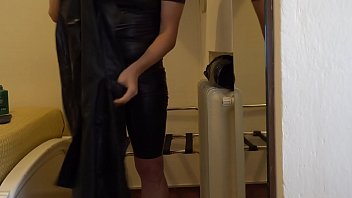 Preview 1 of Buty Hass Ticher - Wearing a black latex female S-size catsuit