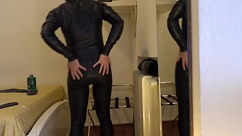 Preview 4 of Buty Hass Ticher - Wearing a black latex female S-size catsuit
