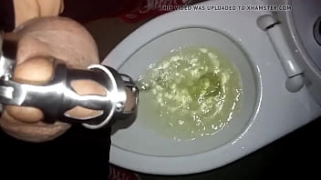 Preview 2 of Wapttick Com - Tomsfag pissing in the public toilet while locked in a chastity cage