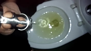 Preview 1 of Wapttick Com - Tomsfag pissing in the public toilet while locked in a chastity cage