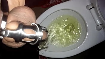 Preview 4 of Wapttick Com - Tomsfag pissing in the public toilet while locked in a chastity cage