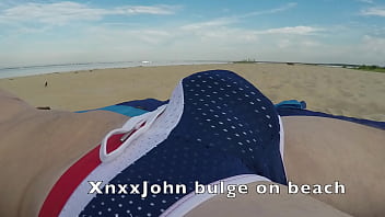 Preview 1 of Sunyleloen - XnxxJohn shows huge speedo bulge on beach