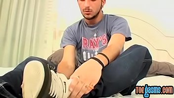 Preview 1 of Girl Lick Girl Asshole - Young hottie teases with his perfect feet while tugging