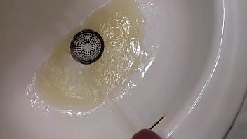 Preview 2 of Irene Noren - Golden shower in the bathroom sink