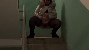 Preview 3 of Xxxx Videoc - Golden shower in public places,  bbw with a big ass and with a hairy pussy pissing on the stairs in the common entrance.
