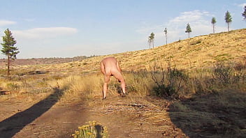 Preview 2 of Lva Lovia - Naked picking up firewood for camp.
