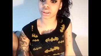 Preview 1 of Shemale Scato - tattooed ebony showing off her titties