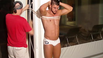 Preview 1 of Teacher Class Xxx - Peter tied up and gagged in a pole struggling moaning for scape. Brazilian man tied up and gagged | Behind the Scenes
