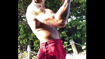 Preview 2 of Emilly Addison - BICEP FLEXING AT THE BEACH