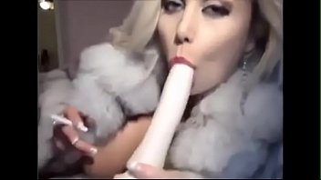 Preview 3 of Ugly Old Tranny - sexxxy blond deepthroats smokes in a fur