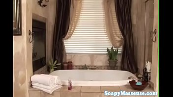 Preview 1 of Analy Maid Videos - Petite blonde masseuse wanks cock in bath