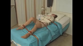Preview 3 of Beg Xxx Mom - Pretty brunette in Straitjacket taped mouth tied to bed hospital