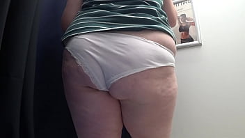 Preview 3 of Indaian New - Big ass in white panties in the fitting room tries on tight leggings,  while the camera watches. Chubby milf. PAWG close-up.