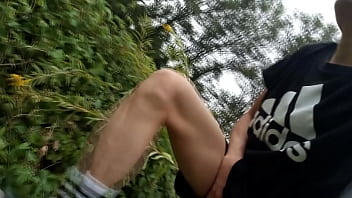 Preview 1 of Shemale While - Jon Arteen,  a gay Asian twink,  is dressed in an Adidas t-shirt,  hot pants,  white socks,  and Duramo sneakers. He jerks off his shaved cock and ejaculates thick cum outdoors.