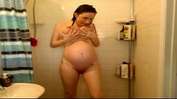 Preview 4 of Tatood Fluk - pregnant woman plays with pussy in shower - PregnantHorny.com