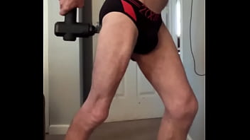 Preview 1 of 9 Rat Xxx Desi Girl - Double Massage Gun pain relief standing in black and red briefs