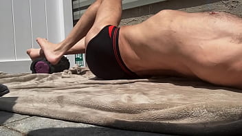 Preview 1 of Phone Roctica - Stop Action Core Stretching on Patio in Black and Red Briefs