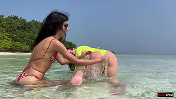 Preview 2 of Movie Sexs - Wet girlfriends play on a public beach and pee on each other