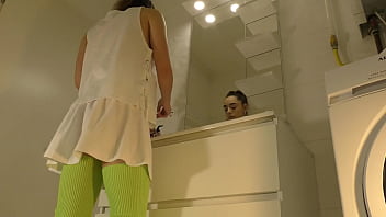 Preview 2 of Acters Blue Film - Hot Brunette College Girl with a Mini Tennis Skirt and Over Knee Socks in the Bathroom shows Panties Under Her Short Skirt and goes also No Panties